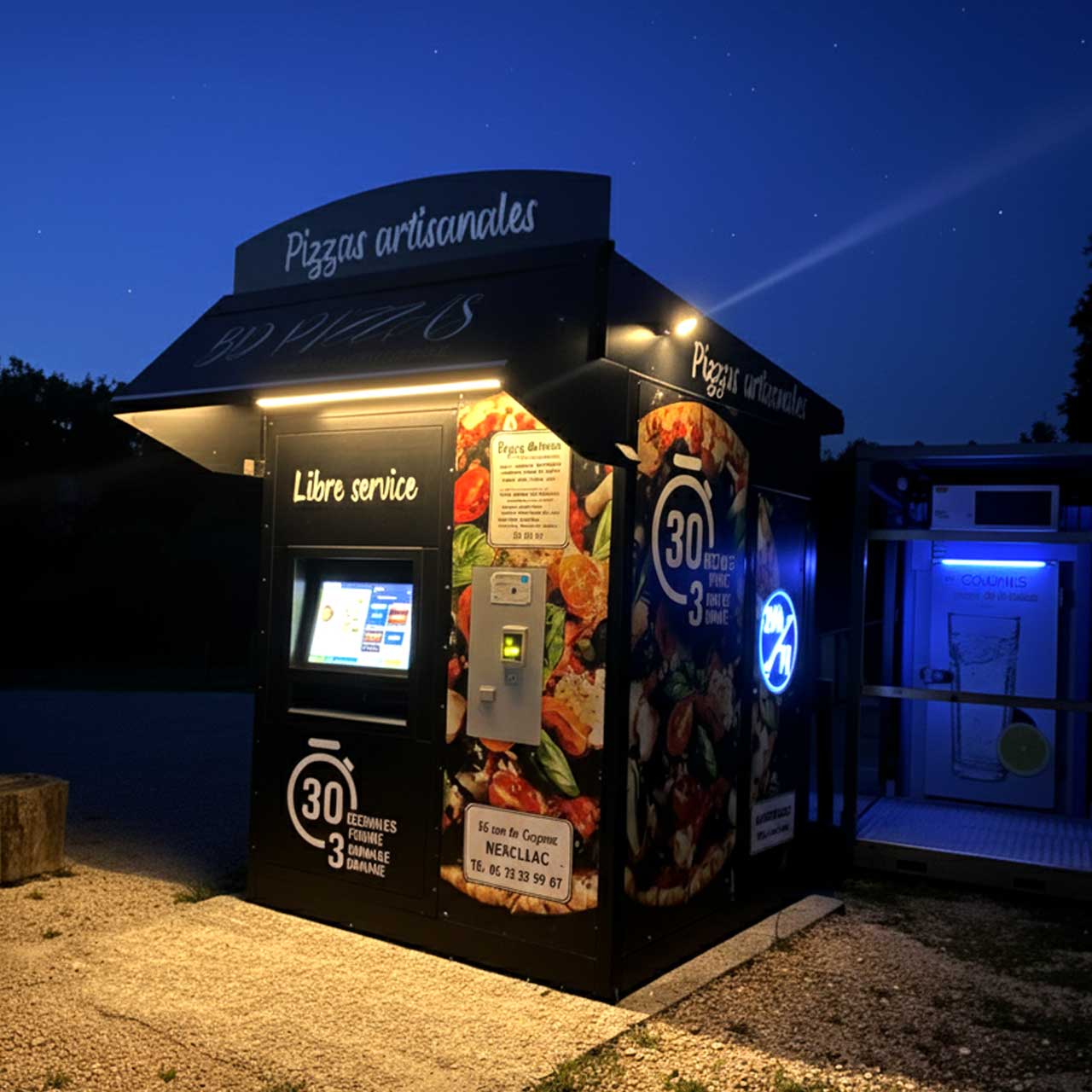 Distributeur BD Pizzas éclairé la nuit – Des pizzas chaudes prêtes à minuit ou à l’aube, même à Bassac ou Graves-Saint-Amant